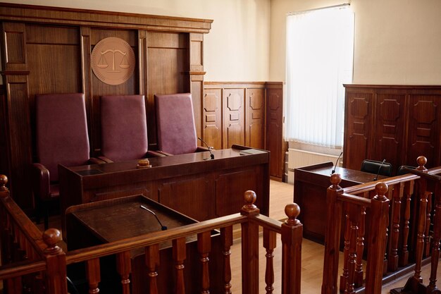 Spacious courtroom featuring wooden furniture, leather chairs, and a judge's bench, symbolizing legal authority and professionalism in family law matters.
